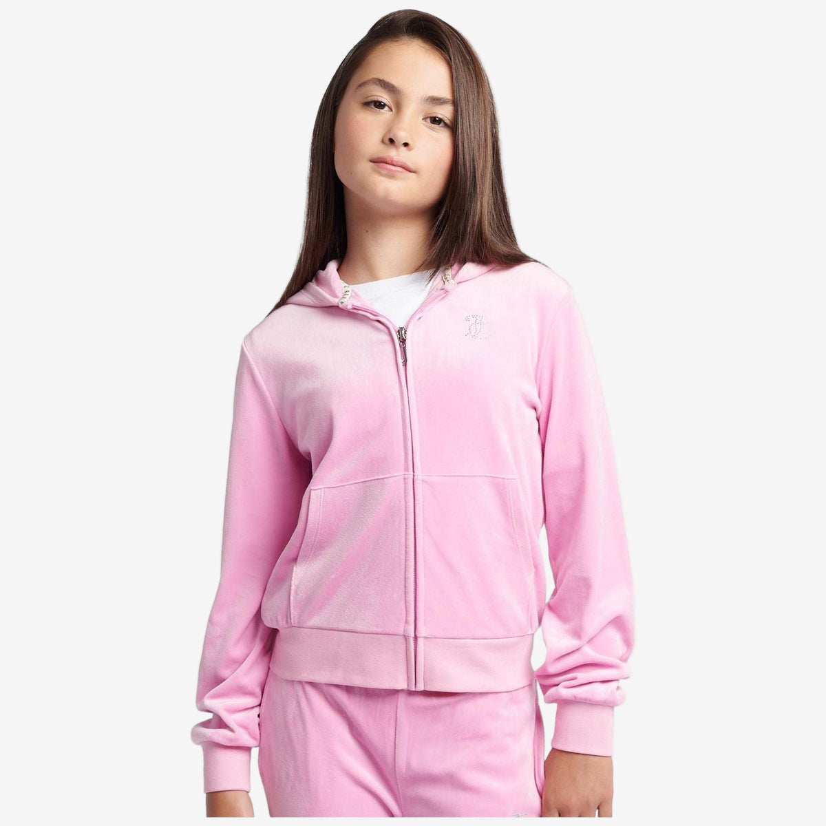 Person wearing a pink tracksuit on a white background