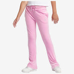Pink sweatpants worn by a person on a white background