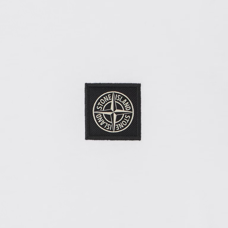 A small black square patch with the circular Stone Island compass logo in white, centered on a light gray background.