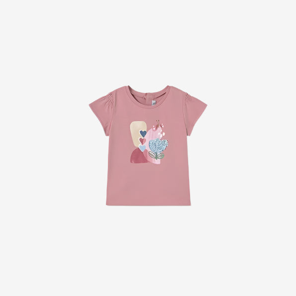 A pink t-shirt with a rose print and a cartoon character wearing a party hat.