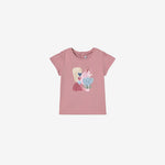 A pink t-shirt with a rose print and a cartoon character wearing a party hat.