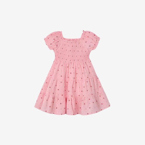 Pink dress with small floral pattern on a white background