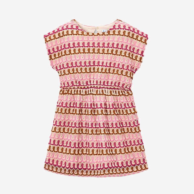 Pink and brown patterned dress on a light gray background