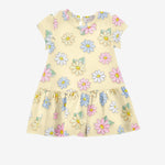 A sleeveless, yellow baby dress with a floral daisy print, featuring a gathered frill round neckline and a low waist with a gathered flounce.