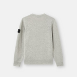 A light gray heather knit sweater shown from the back, featuring a small black rectangular brand patch on the left sleeve.