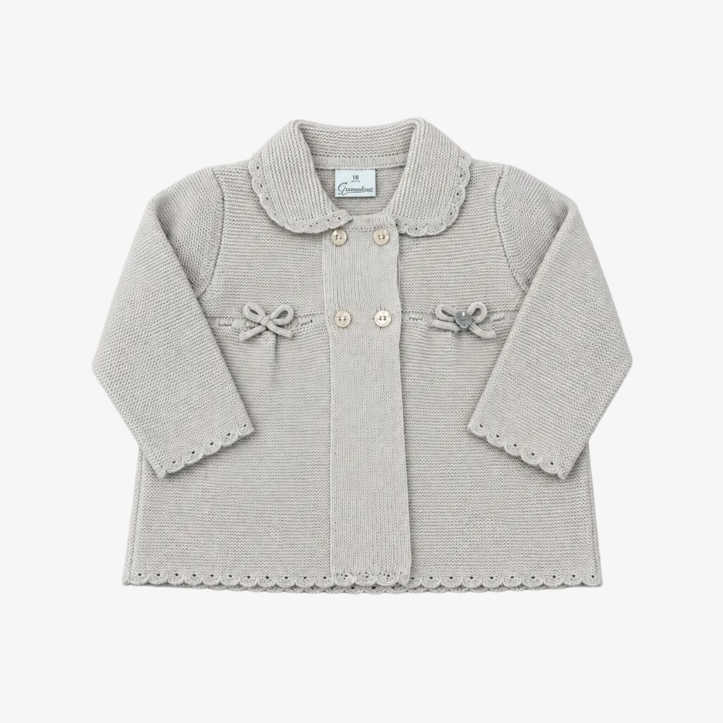 A light gray knit baby cardigan with a Peter Pan collar, three front buttons, decorative bows on the chest, and scalloped edges on the sleeves and hem, shown flat on a gray background.