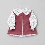 A children's long-sleeve blouse featuring a dusty rose corduroy vest over a white long-sleeve shirt with a small multicolor floral print, laid flat on a neutral gray background.