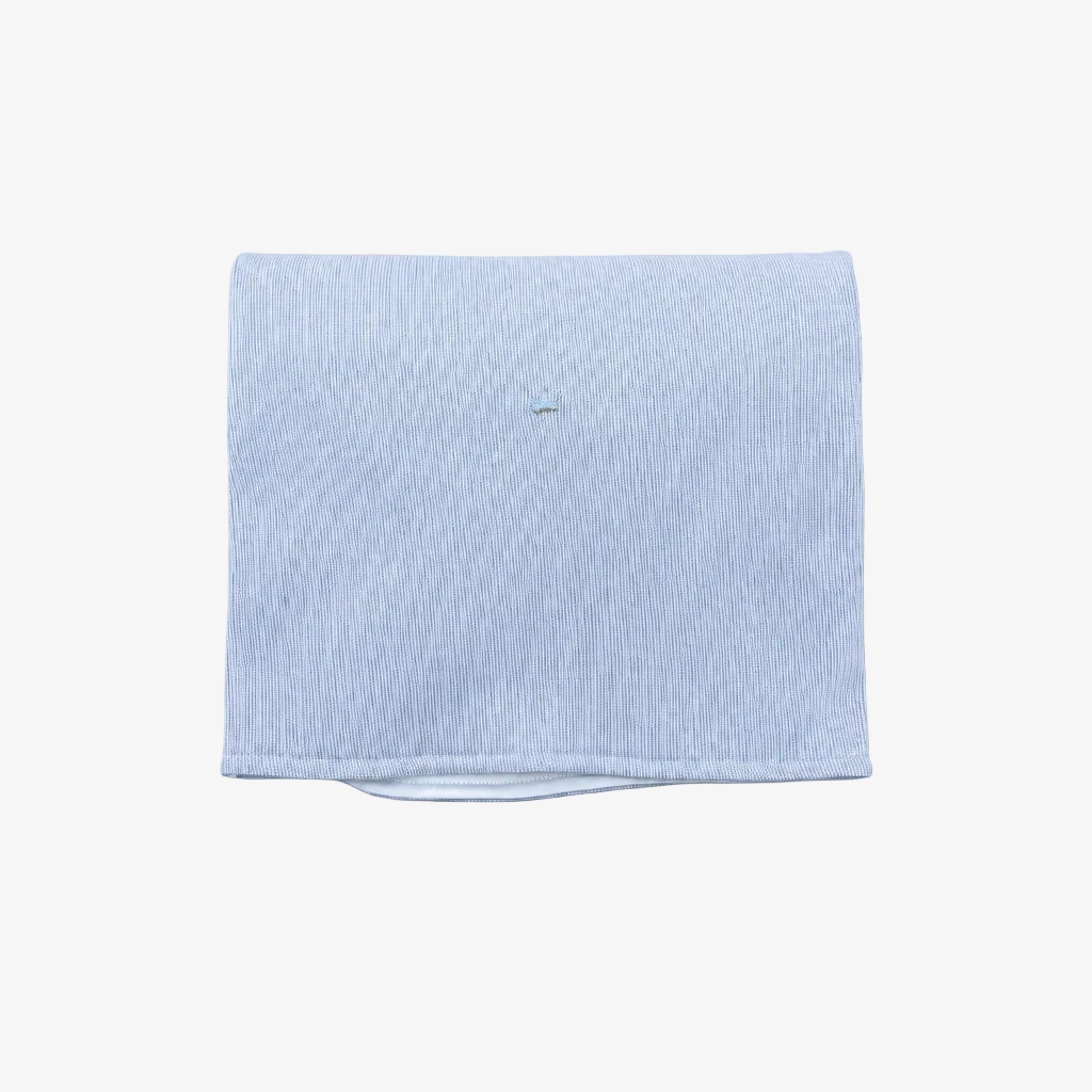 A folded light blue striped fabric item, likely a pocket square or small napkin, displayed on a neutral gray background.