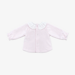 A light pink long-sleeve baby cardigan with a white ruffled Peter Pan collar and button front, laid flat on a neutral gray background.