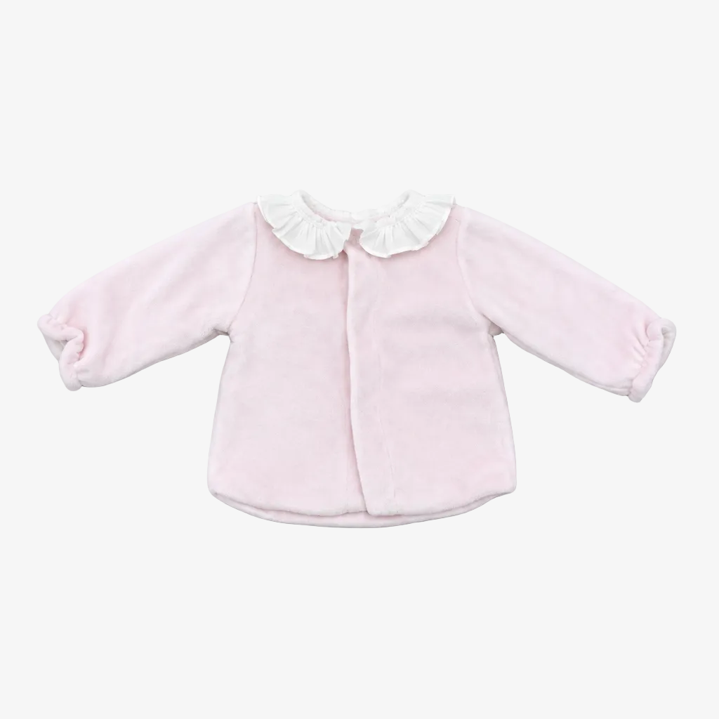 A light pink long-sleeve baby cardigan with a white ruffled collar, laid flat on a neutral gray background.