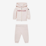 Pink Moncler tracksuit on a white background