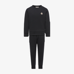 A dark charcoal gray two-piece tracksuit featuring a long-sleeve crewneck sweatshirt and matching jogger pants, with a small embroidered Moncler logo on the left chest.