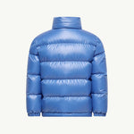A shiny blue puffer jacket shown from the back, featuring horizontal quilting and a high stand-up collar, set against a plain off-white background.