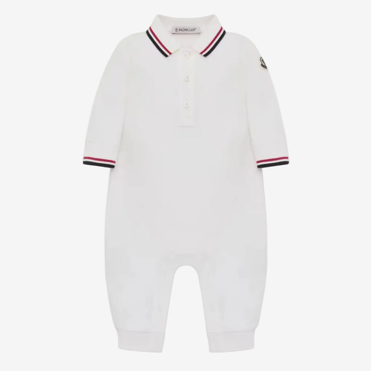 A white long-sleeve baby romper with a polo-style collar, featuring navy and red striped trim on the collar and cuffs, and a small black embroidered logo on the left sleeve.