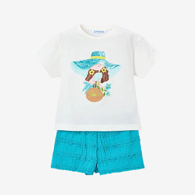Children's outfit with white shirt and blue shorts featuring a sun hat and flower design on a white background.