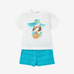 Children's outfit with white shirt and blue shorts featuring a sun hat and flower design on a white background.