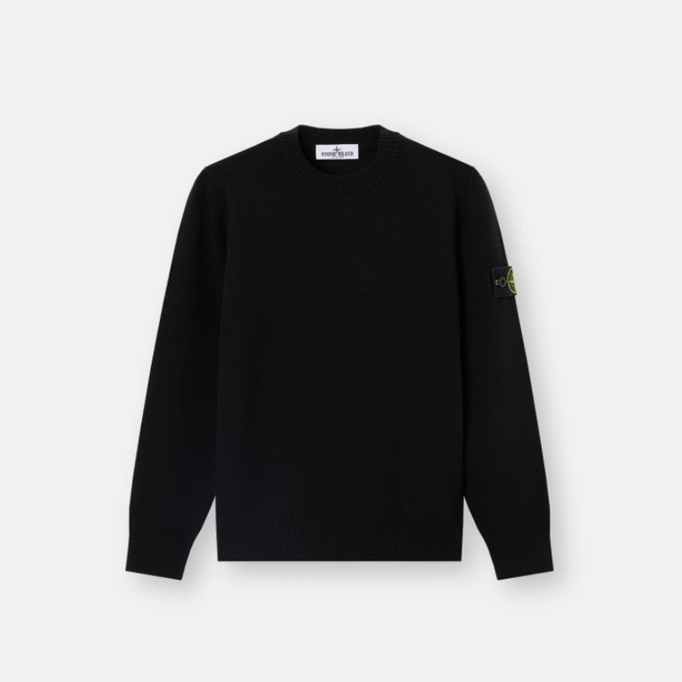 A black long-sleeve crewneck sweater with the Stone Island compass logo embroidered on the left sleeve.
