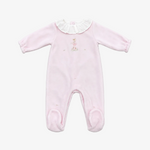 A light pink long-sleeve baby footed romper with a white ruffled collar and a small embroidered bunny on the chest, laid flat on a neutral gray background.
