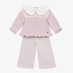 A baby girl's two-piece knit outfit set in dusty pink, featuring a long-sleeve top with a white ruffled Peter Pan collar, lace trim, and ruffled hem, paired with matching ribbed knit pants.