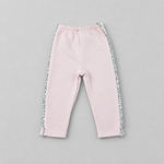A pair of toddler's light pink sweatpants with a floral patterned side stripe, laid flat on a neutral gray background.
