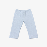 Light blue ribbed knit baby pants with an elastic waistband and a three-button henley-style top, laid flat on a neutral gray background.