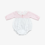 A baby long-sleeve romper in light pink and white, featuring a ruffled Peter Pan collar, three small pink buttons on the chest, and elasticated leg openings, laid flat on a neutral gray background.