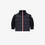 Black puffer vest with a red zipper on a white background