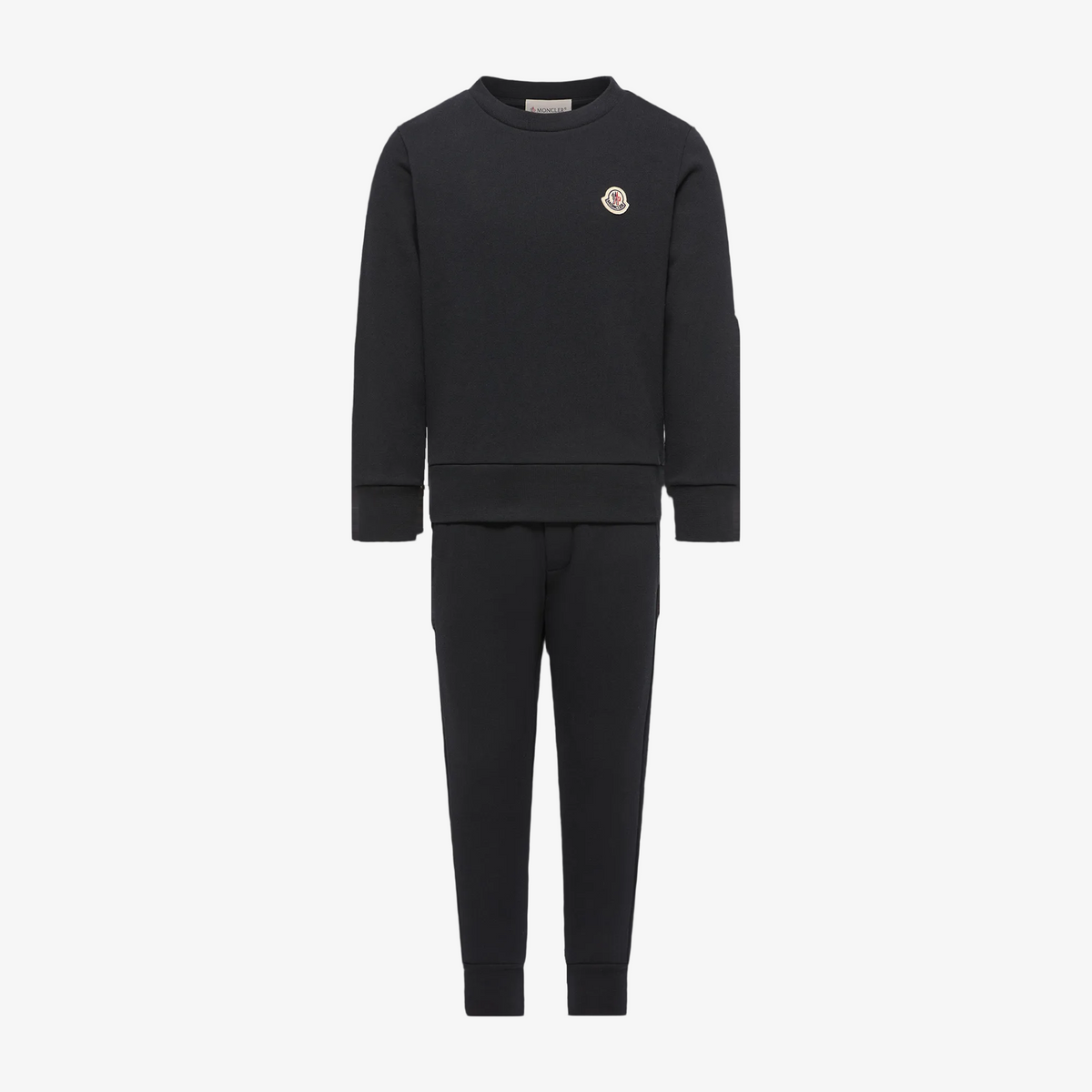 A dark charcoal gray two-piece tracksuit featuring a long-sleeve crewneck sweatshirt and matching jogger pants, with a small embroidered Moncler logo on the left chest.
